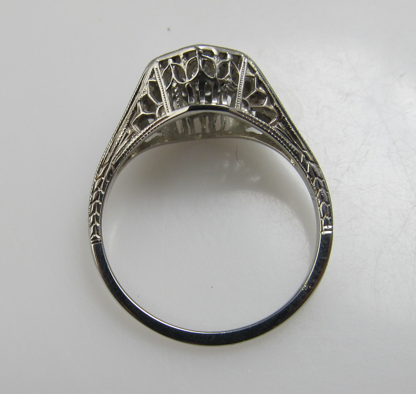 18k white gold filigree ring with a .33ct center diamond, circa 1920