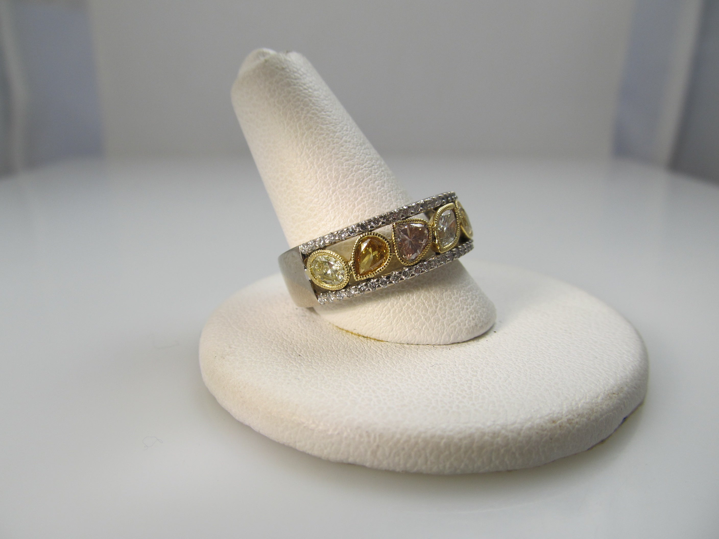 18k white gold band, 1.50ct in fancy yellow diamonds