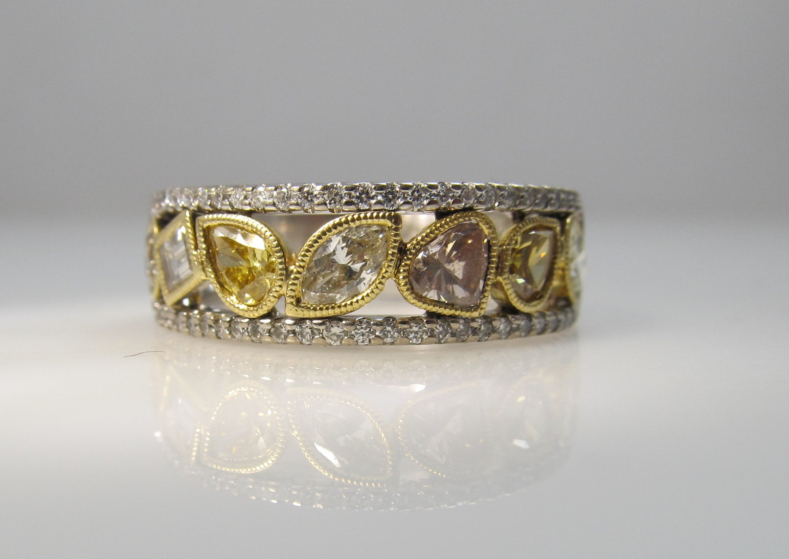 18k white gold band, 1.50ct in fancy yellow diamonds