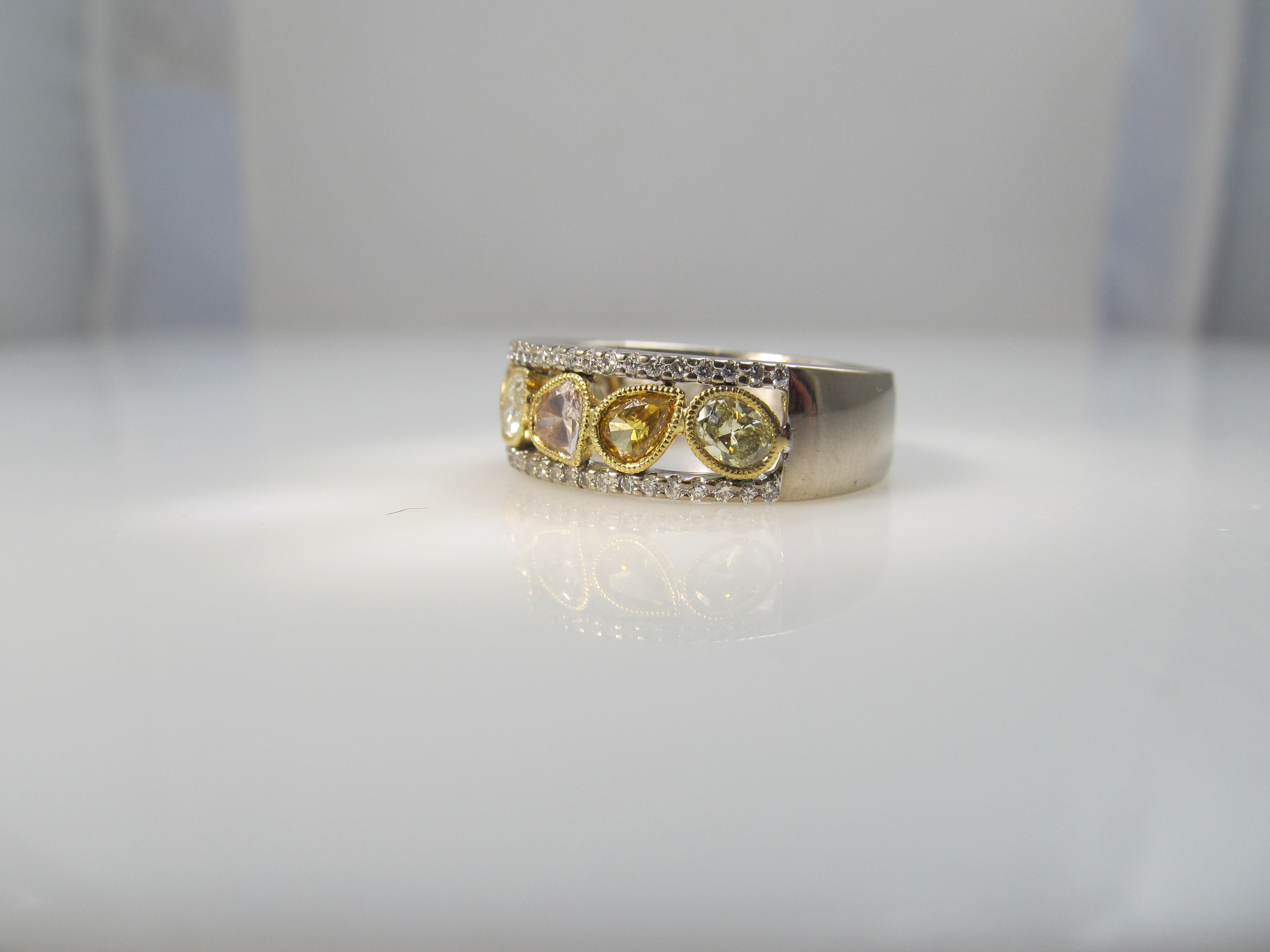 18k white gold band, 1.50ct in fancy yellow diamonds