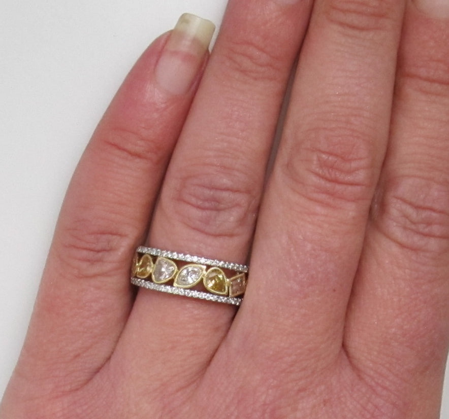 18k white gold band, 1.50ct in fancy yellow diamonds