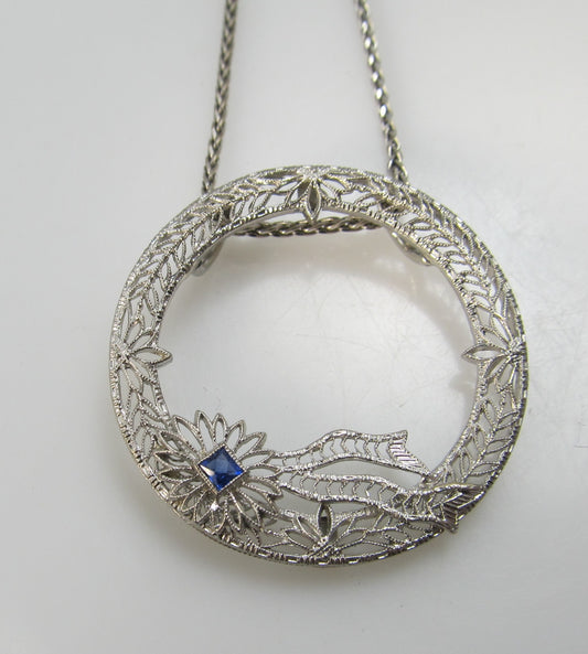14k white gold filigree circle necklace with a sapphire, circa 1920