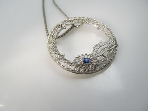 14k white gold filigree circle necklace with a sapphire, circa 1920