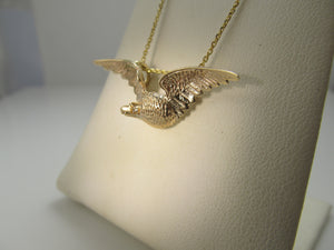 14k rose gold eagle necklace with a diamond eye, circa 1900.