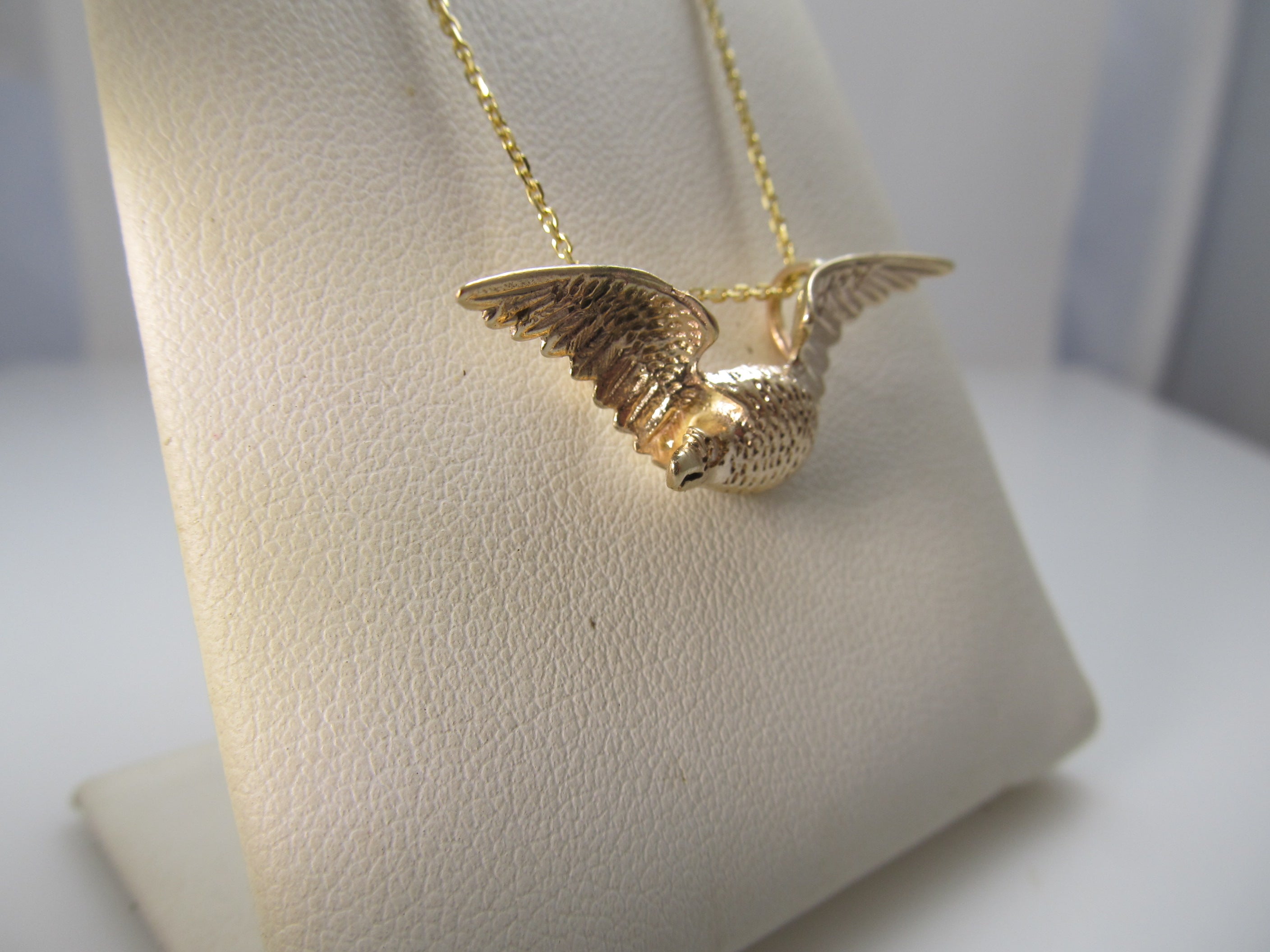 14k rose gold eagle necklace with a diamond eye, circa 1900.