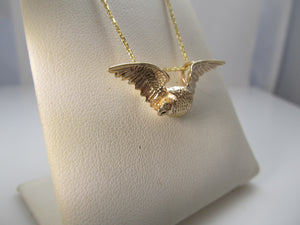 14k rose gold eagle necklace with a diamond eye, circa 1900.