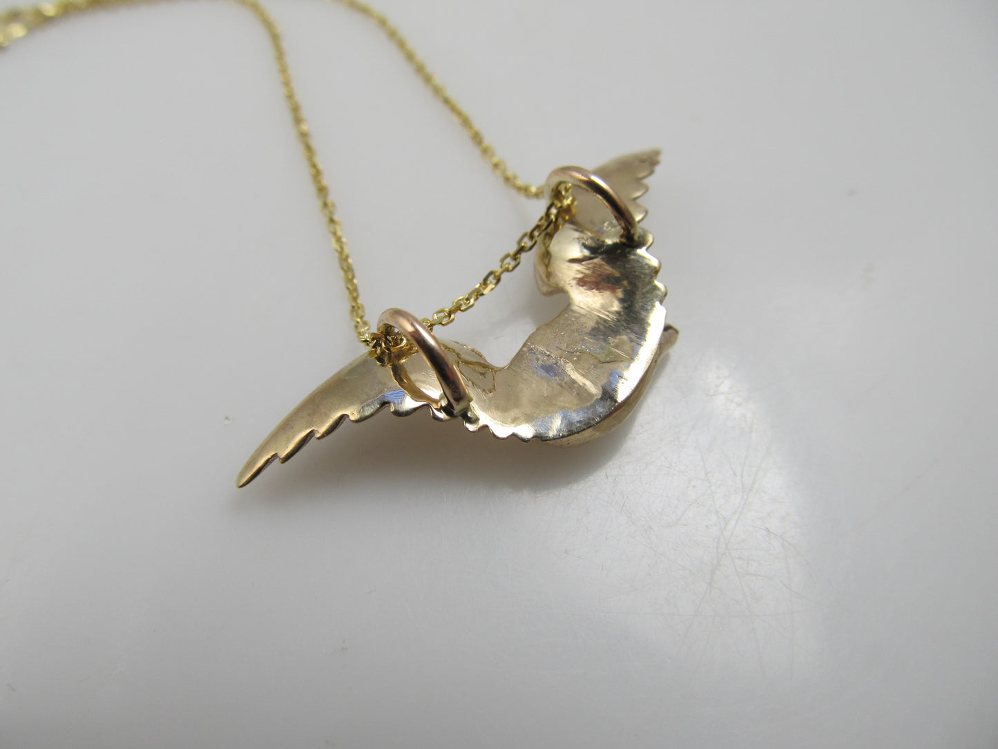 14k rose gold eagle necklace with a diamond eye, circa 1900.