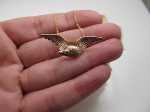 14k rose gold eagle necklace with a diamond eye, circa 1900.