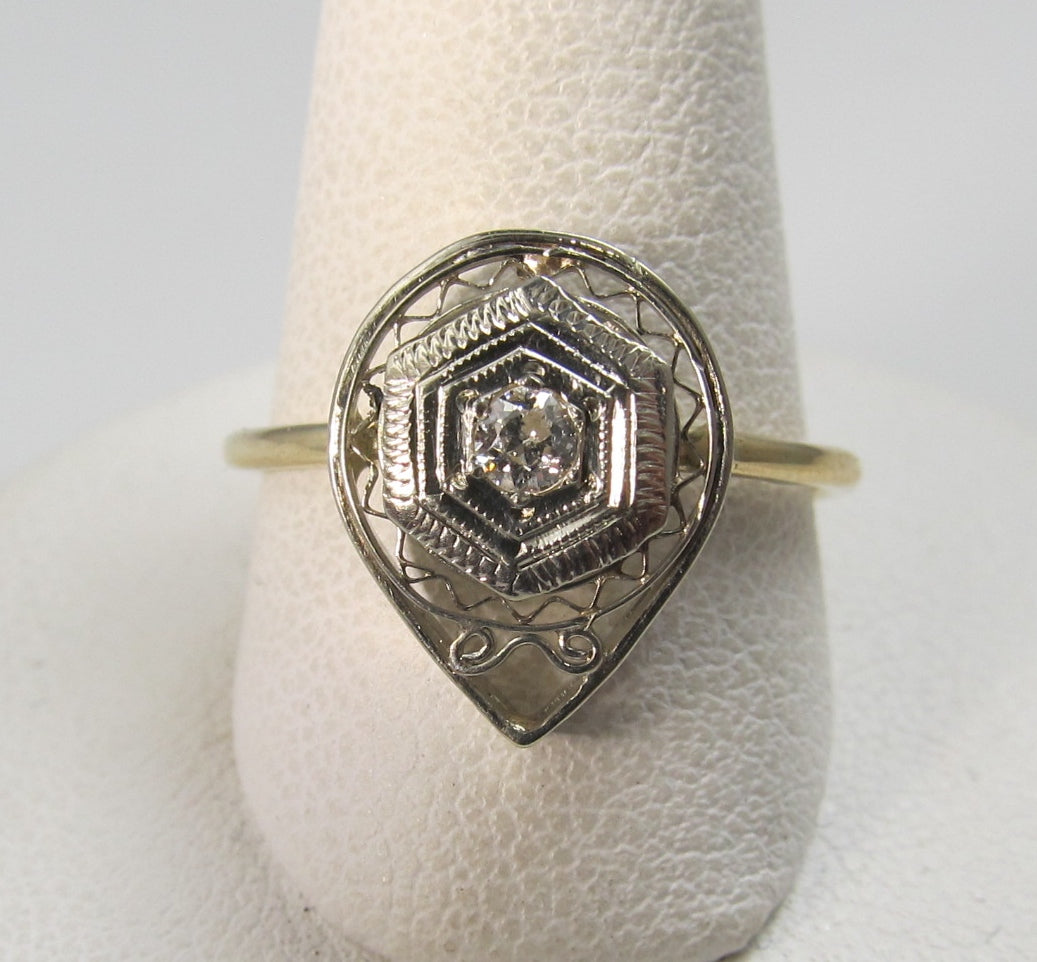 14k white and yellow gold filigree ring with a .10ct diamond, circa 1920.