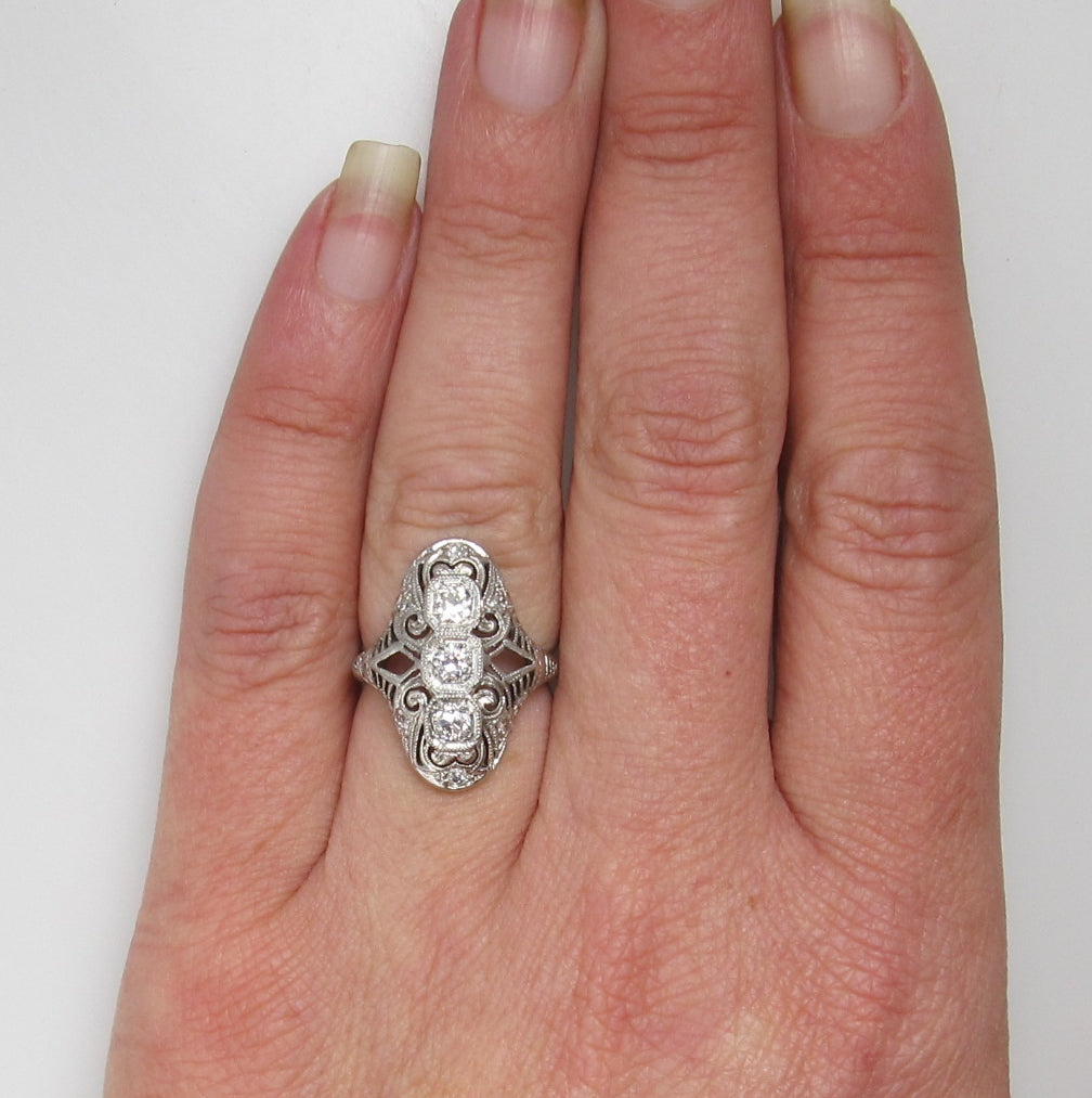 Platinum & 18k long filigree ring with .50cts in diamonds, circa 1920