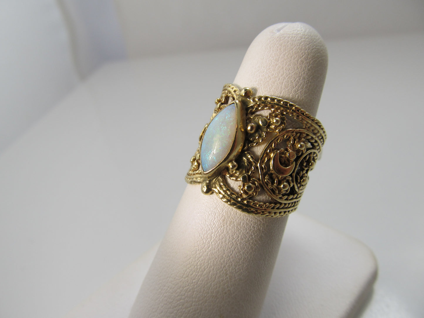 Wide cigar band opal ring