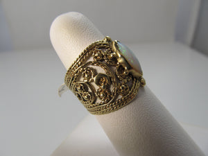 Wide cigar band opal ring