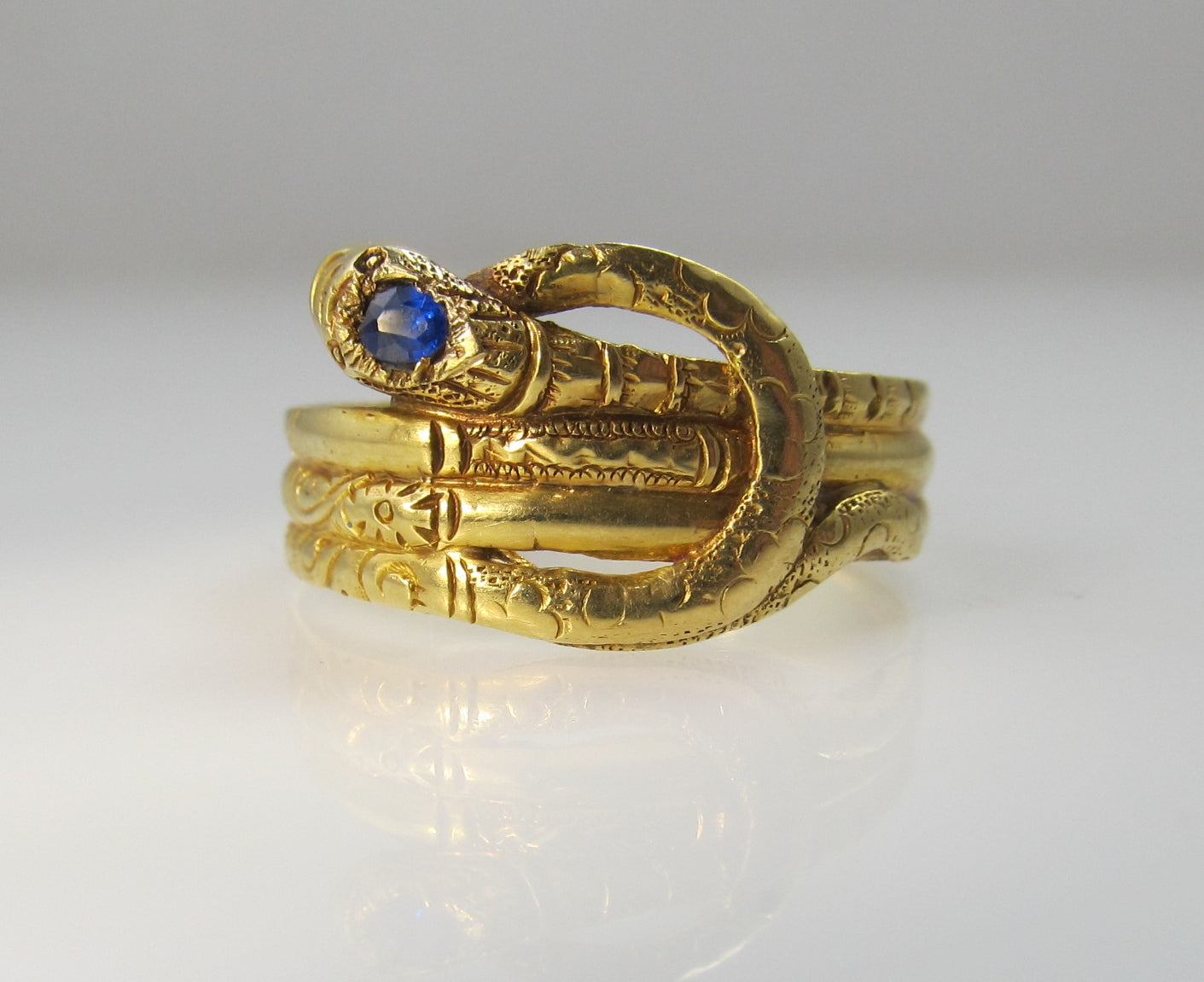 Early Victorian 14k wrapped snake ring with a sapphire