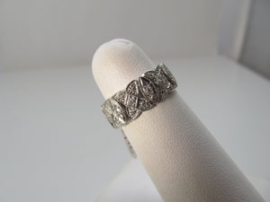 Vintage platinum filigree eternity band