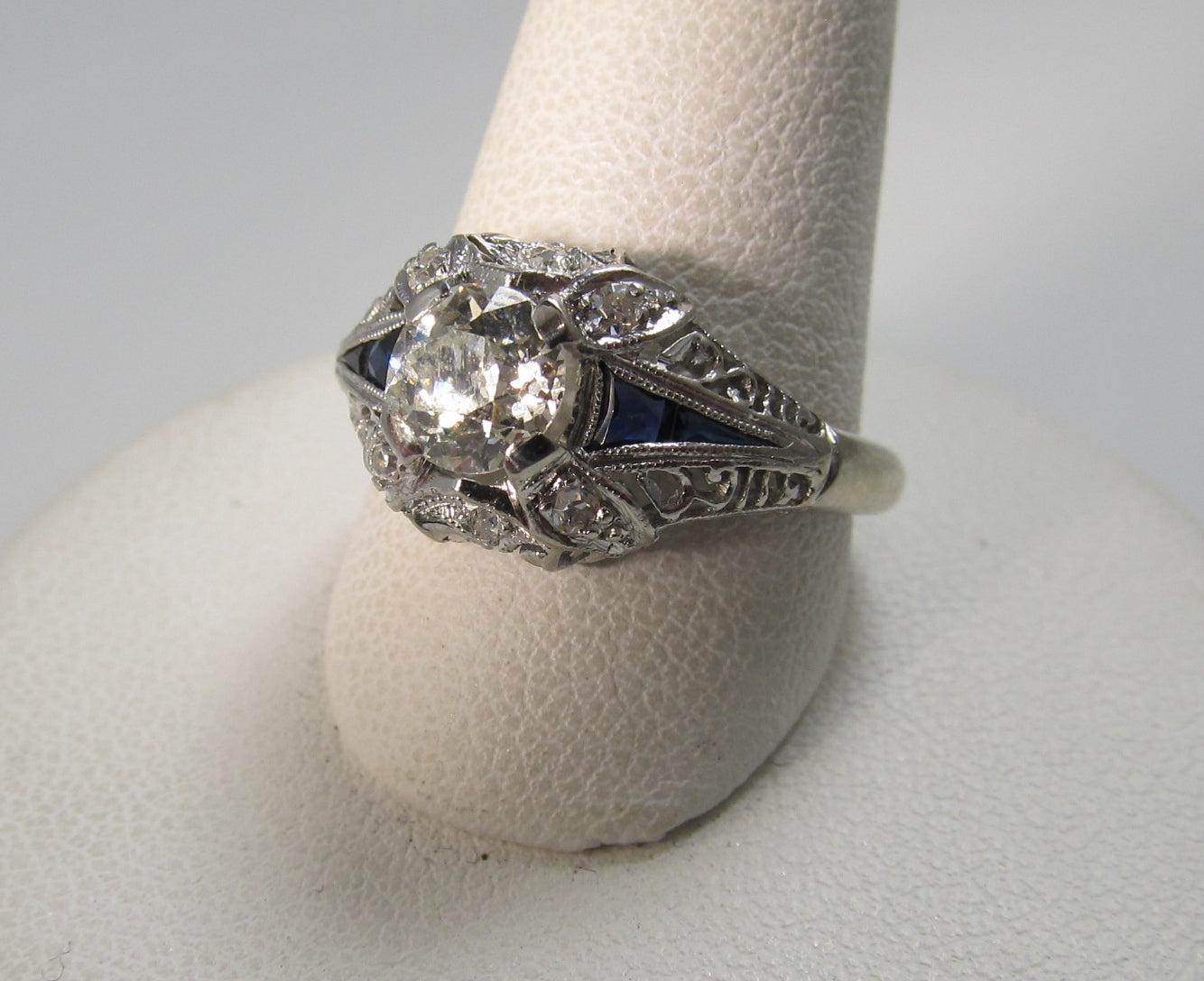 Antique platinum filigree ring with sapphires and a .75ct diamond, circa 1920.