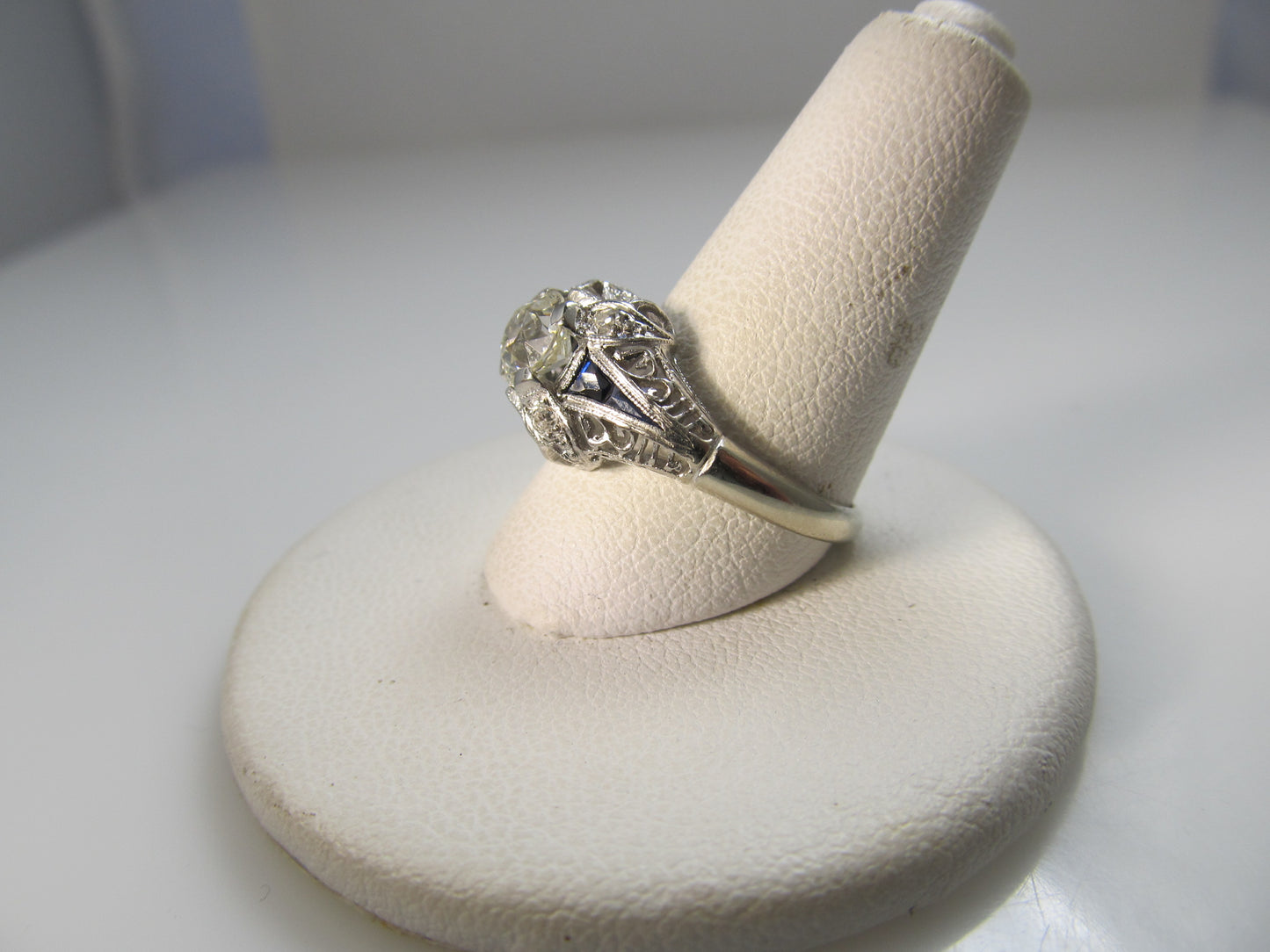 Antique platinum filigree ring with sapphires and a .75ct diamond, circa 1920.