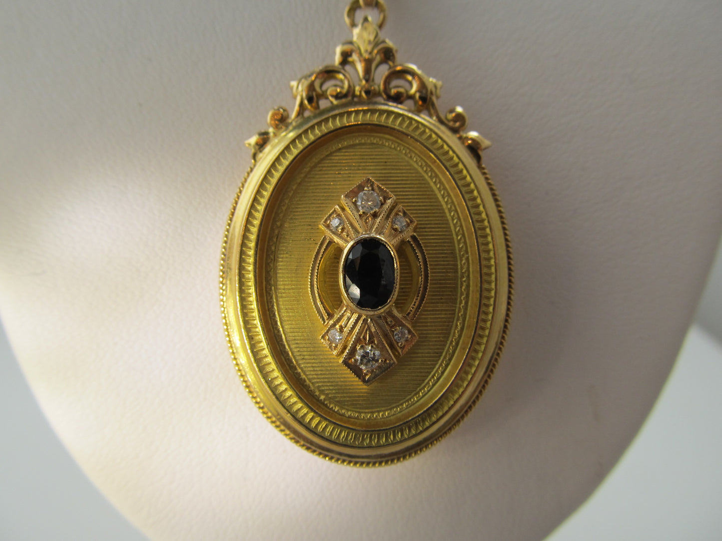 Sapphire and diamond locket necklace