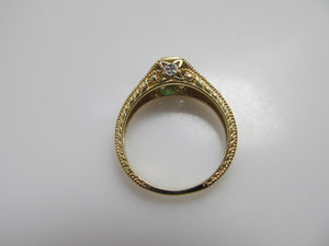 Yellow gold emerald and diamond ring