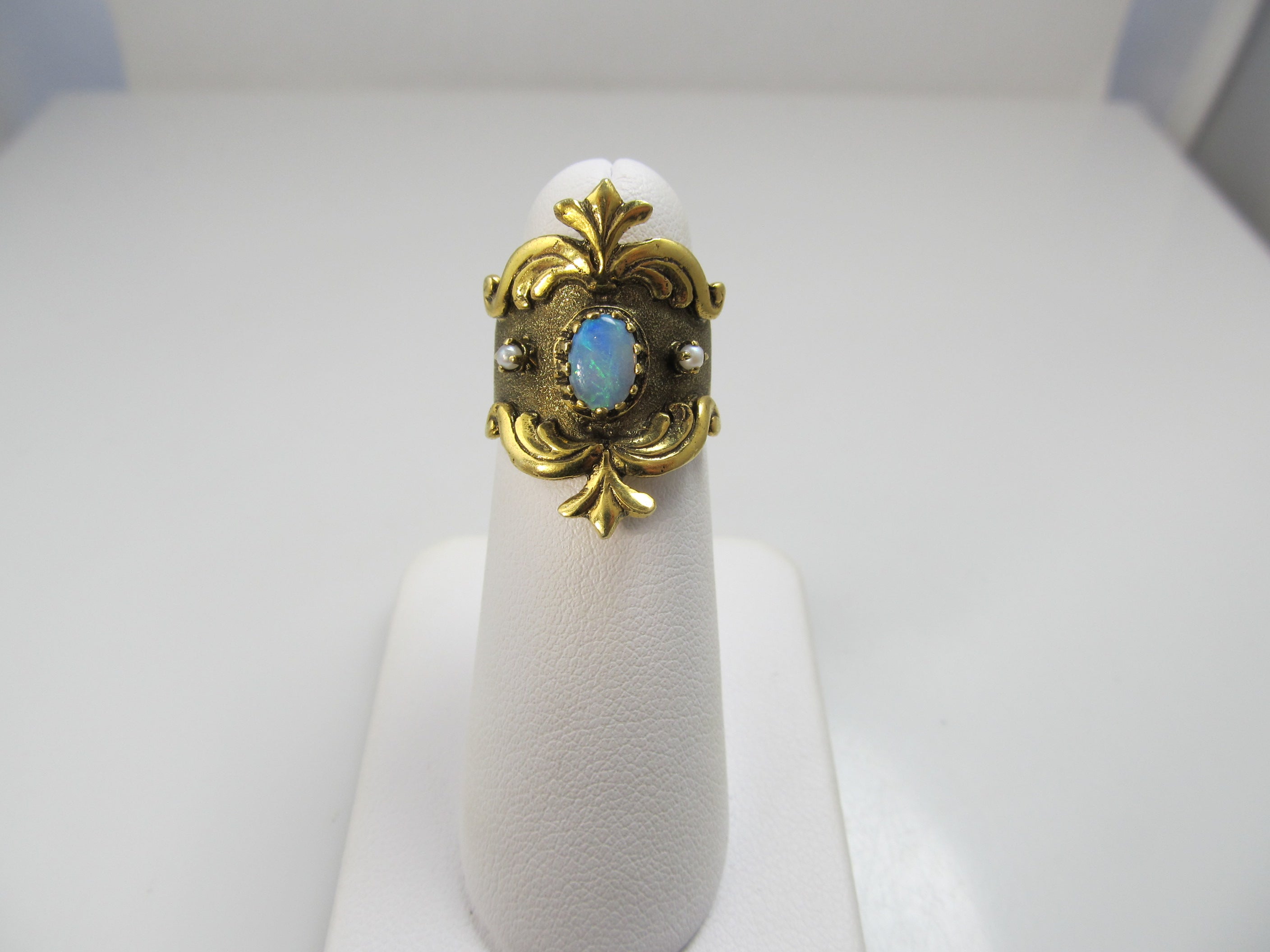 Wide yellow gold cigar band with opal and pearls