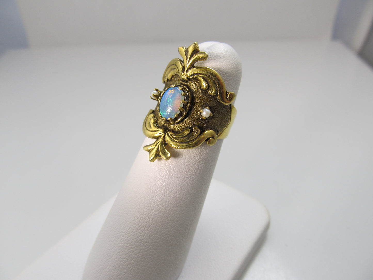 Wide yellow gold cigar band with opal and pearls