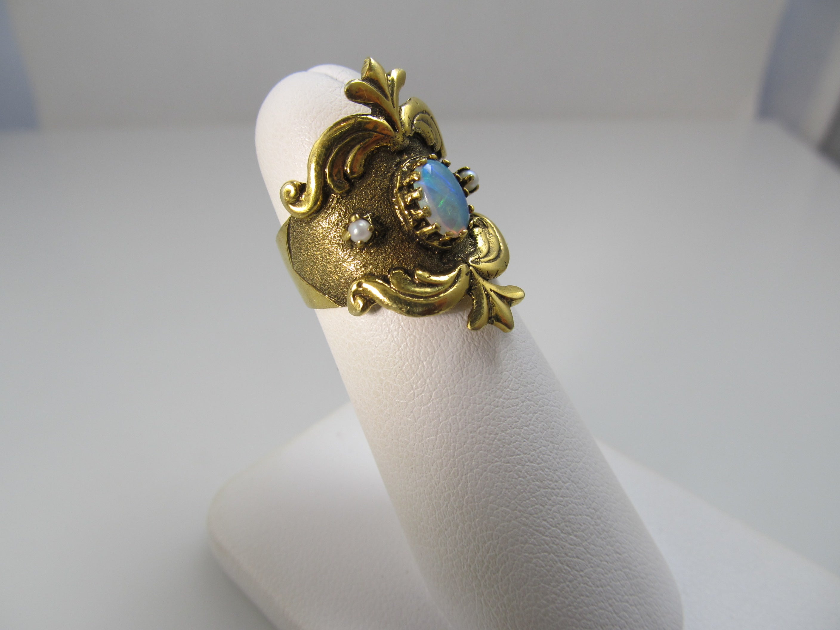 Wide yellow gold cigar band with opal and pearls