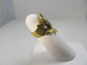 Wide yellow gold cigar band with opal and pearls