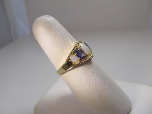 Opal and tanzanite band ring