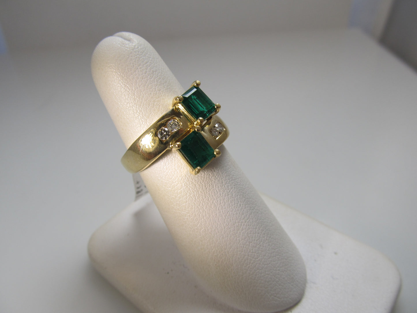 Emerald and diamond bypass ring