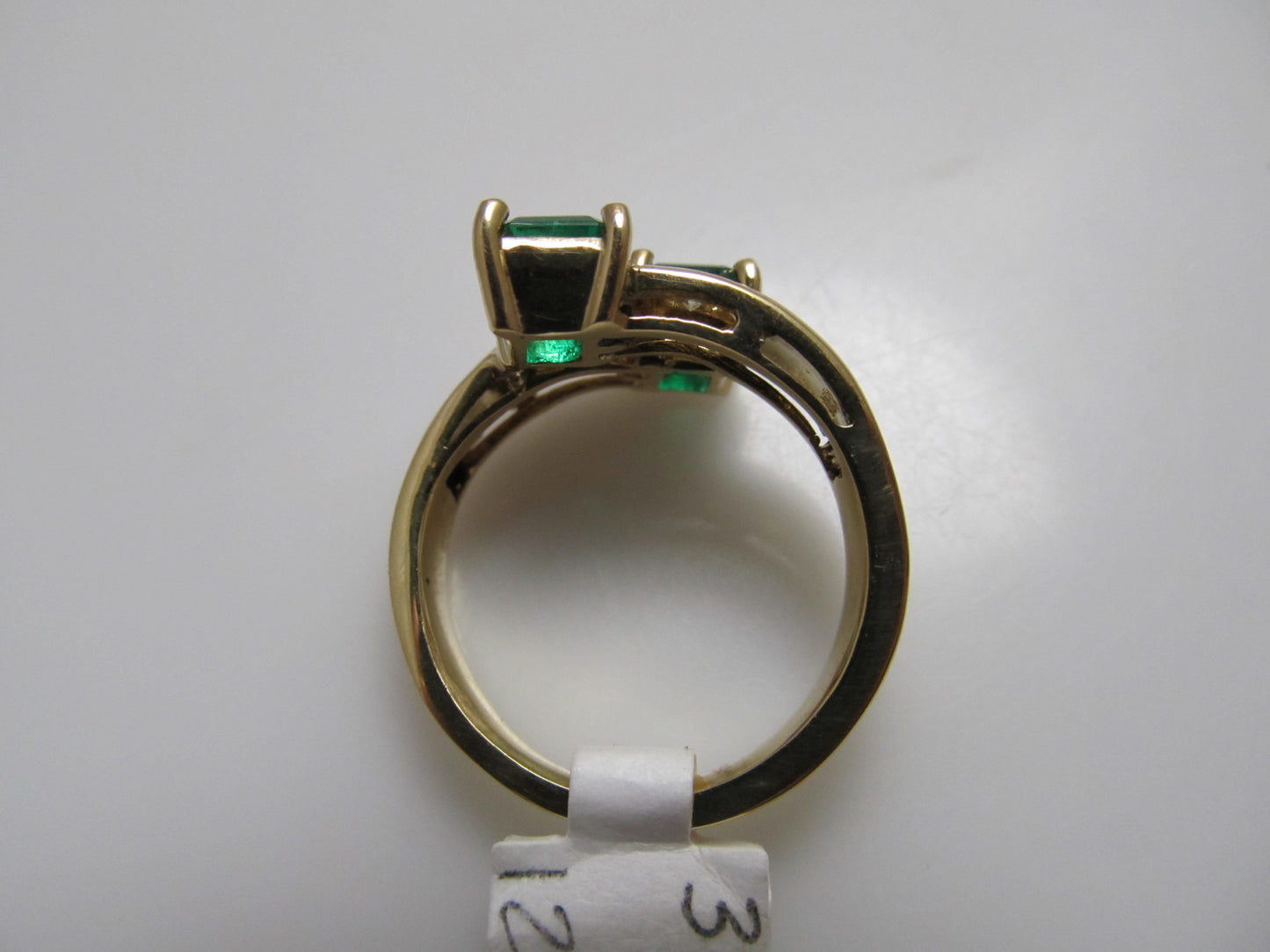 Emerald and diamond bypass ring