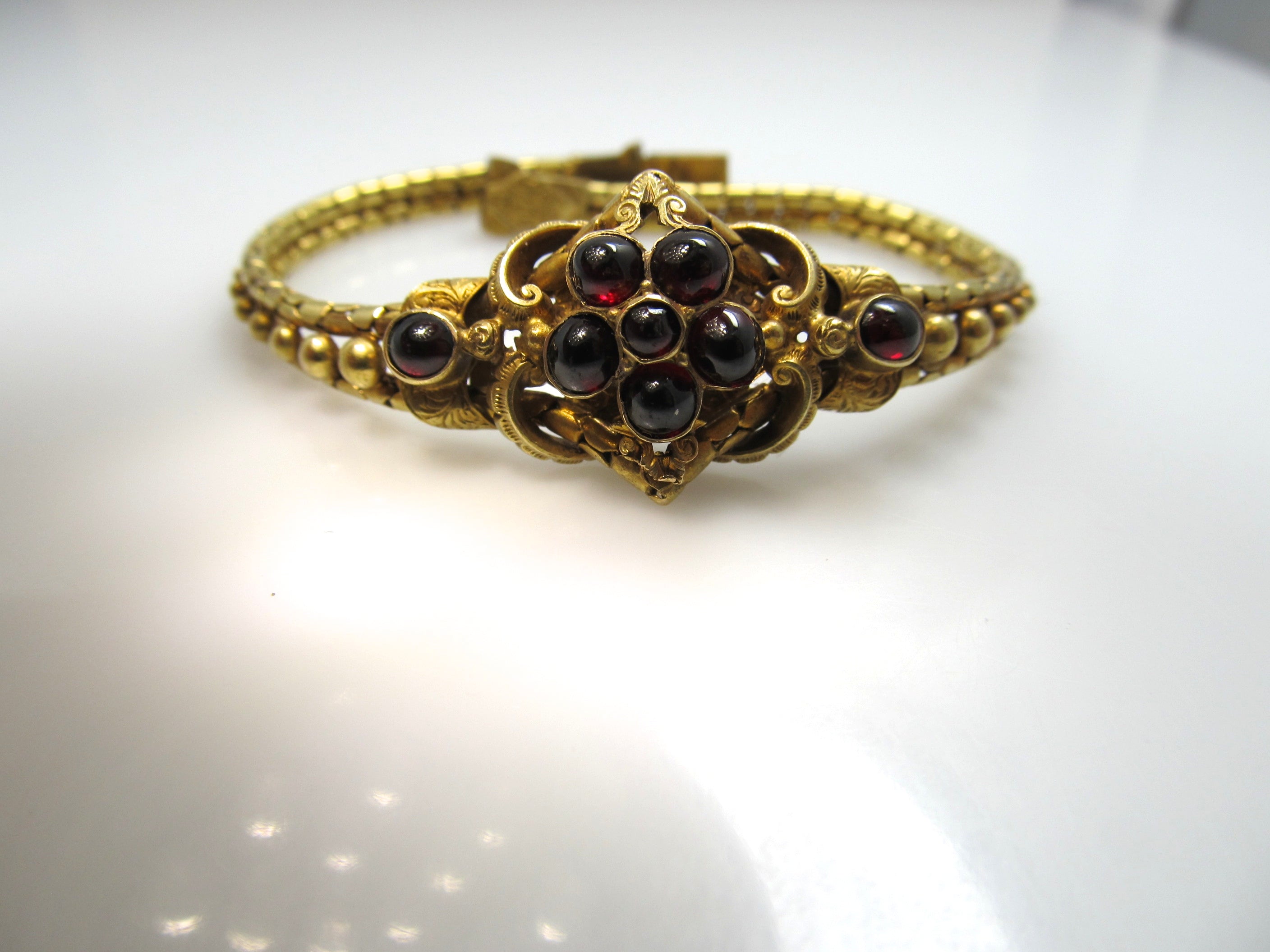 Victorian 14k yellow gold garnet cabochon bracelet, circa 1870