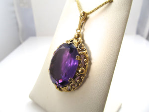 Vintage 14k yellow gold necklace with a large amethyst