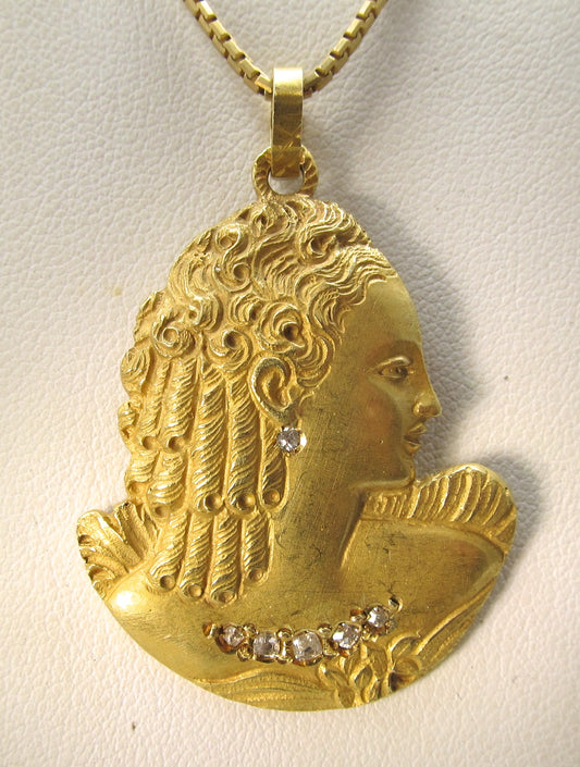Art Nouveau diamond necklace with a woman's profile, circa 1910