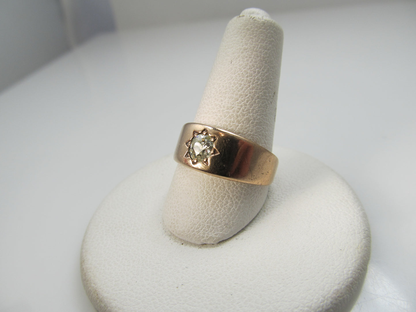 Antique 14k rose gold band with a .40ct cushion cut diamond