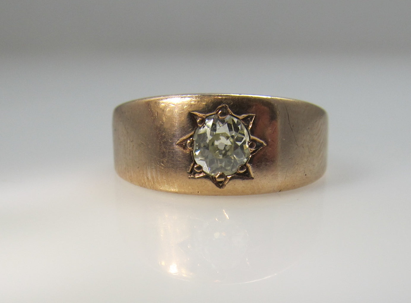 Antique 14k rose gold band with a .40ct cushion cut diamond
