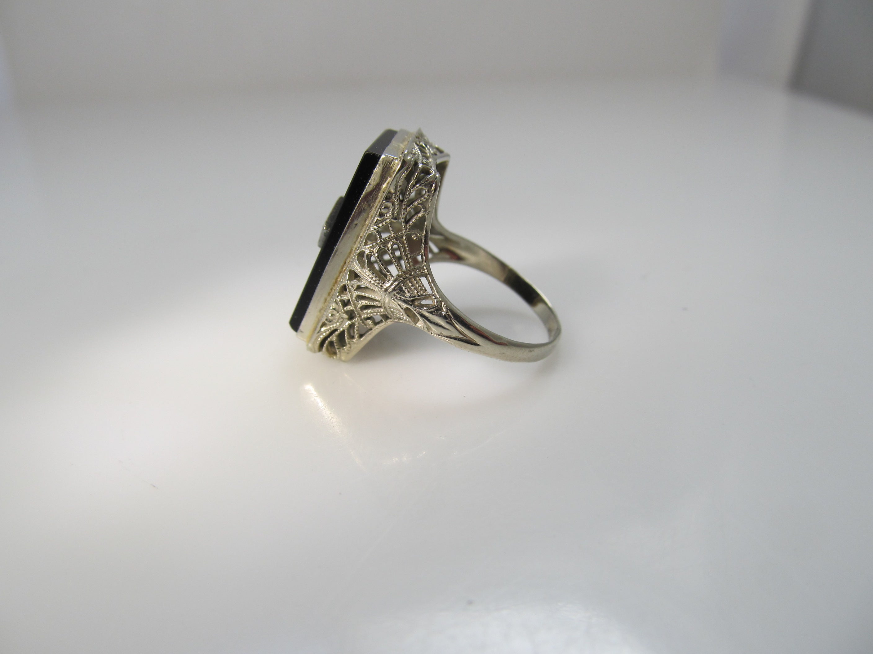 Art Deco onyx and diamond ring, 14k white gold filigree