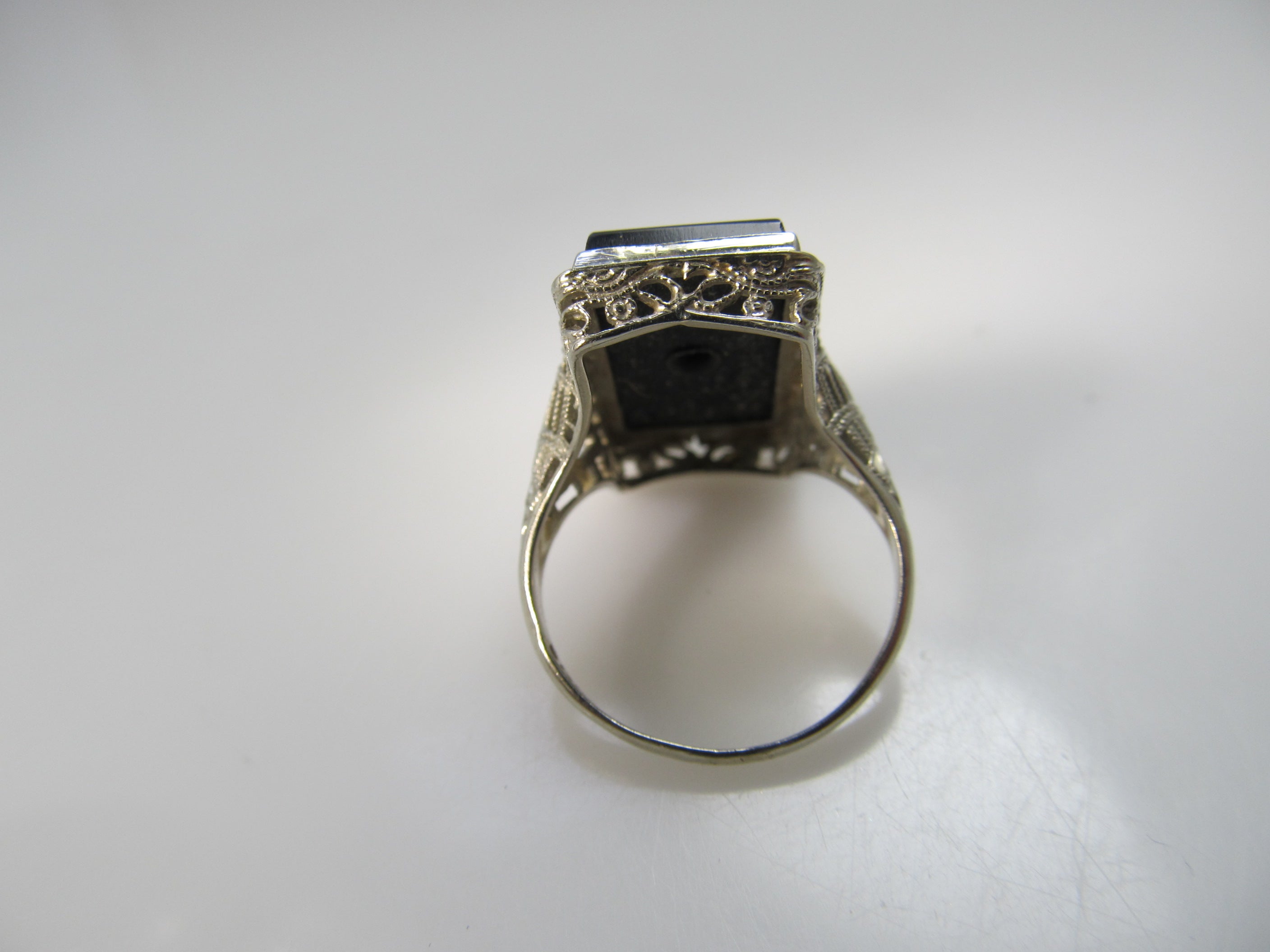 Art Deco onyx and diamond ring, 14k white gold filigree