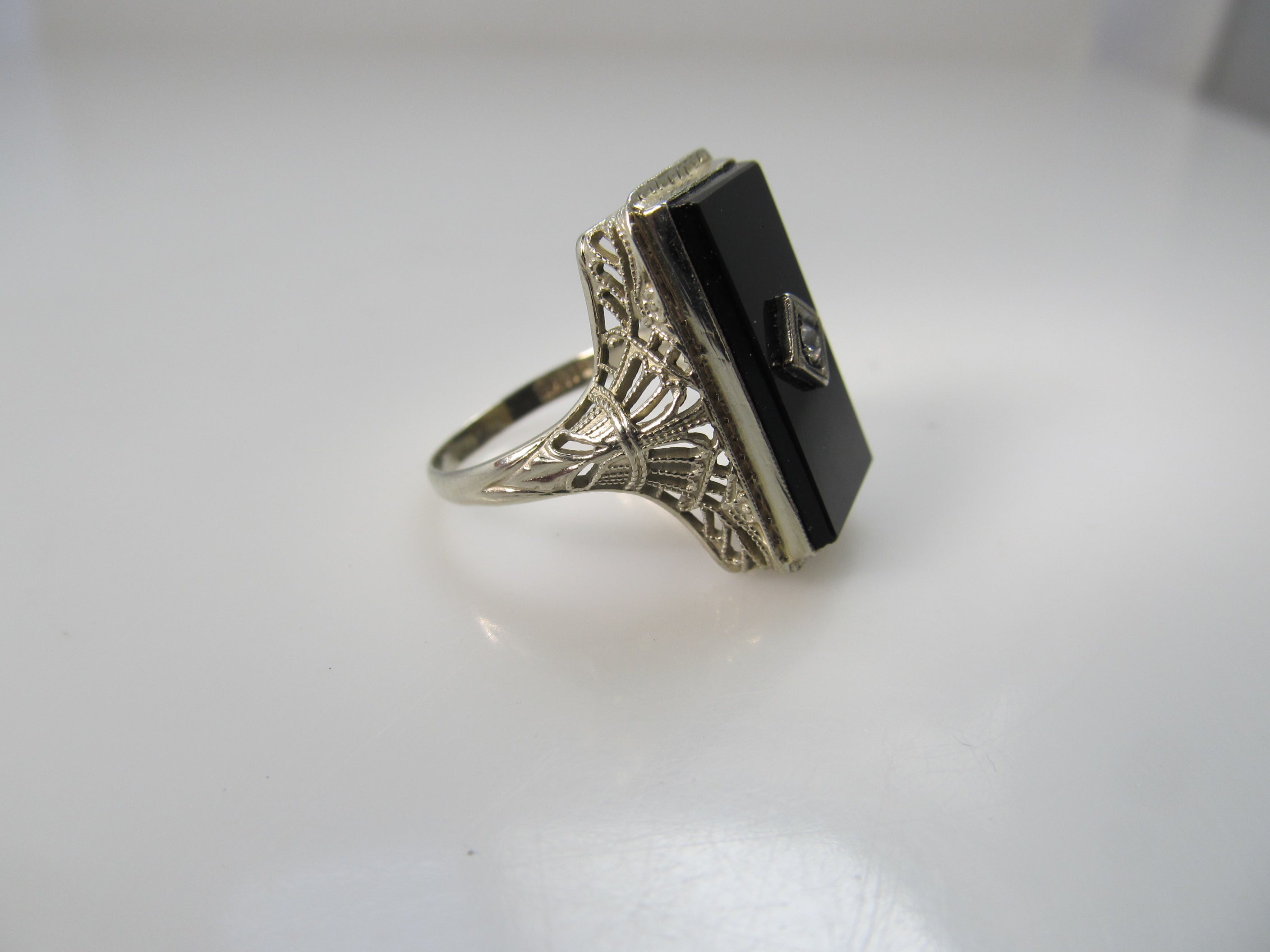 Art Deco onyx and diamond ring, 14k white gold filigree