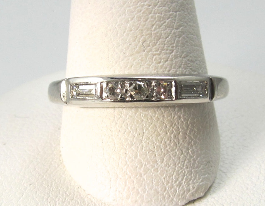 Antique platinum band with round and baguette cut diamonds