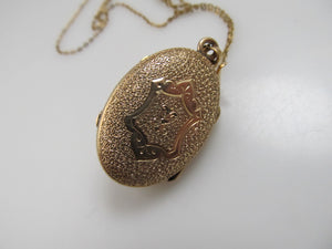 Victorian gold locket with enamel and a pearl