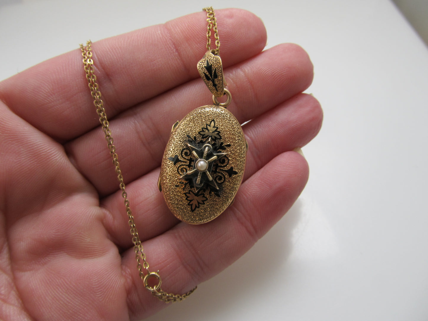 Victorian gold locket with enamel and a pearl