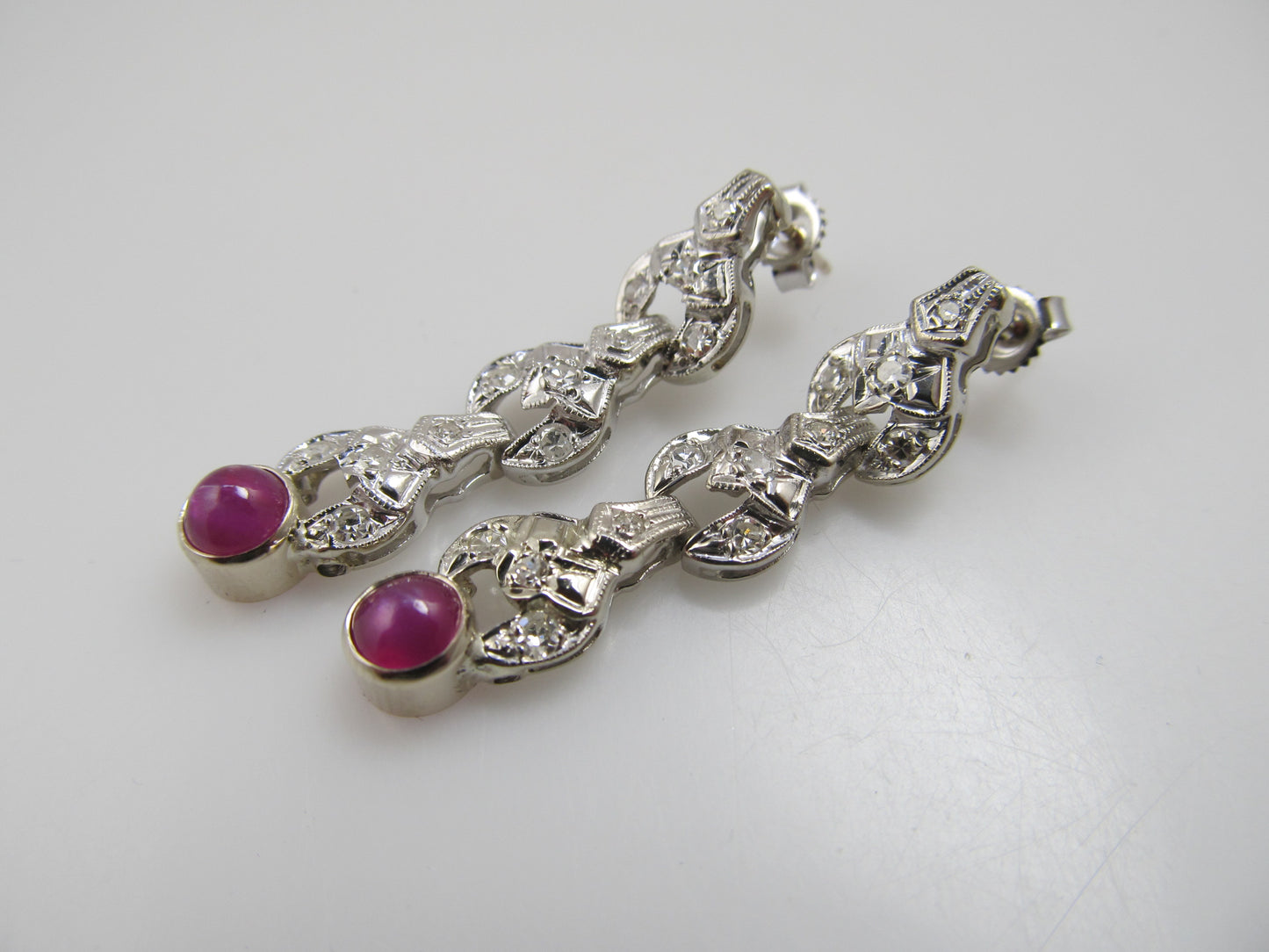 Vintage platinum drop earrings with diamonds and star ruby