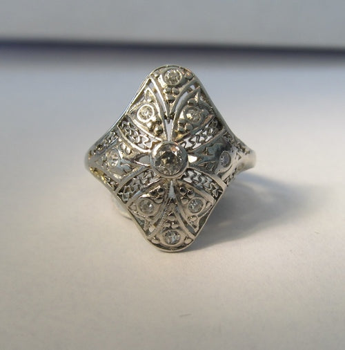 Long antique filigree diamond pinky ring in platinum