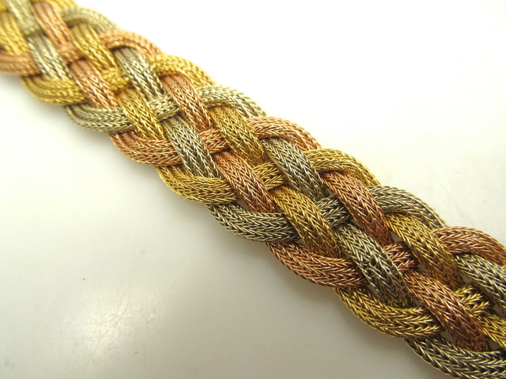 18k white rose and yellow gold woven bracelet.