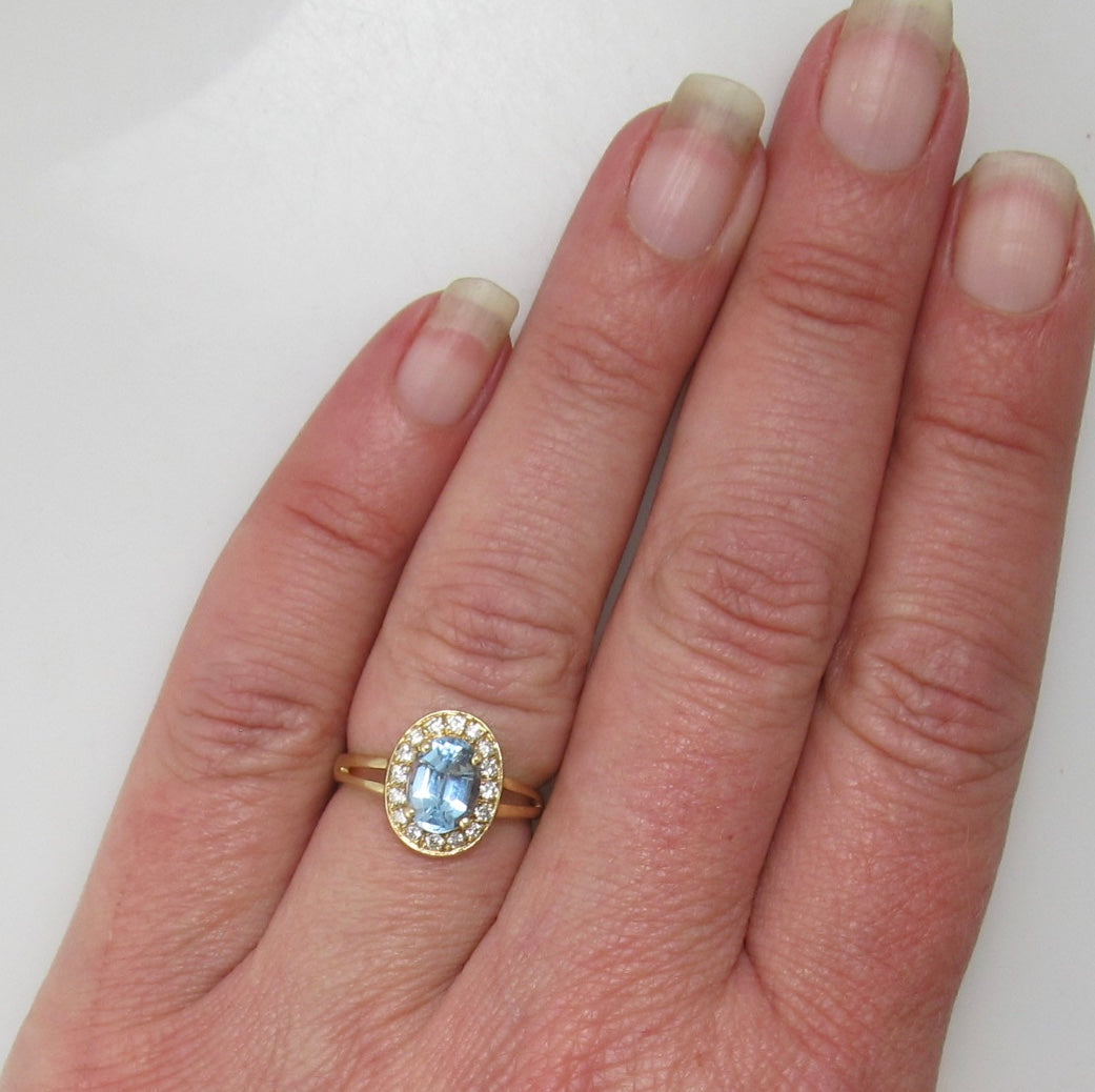 Blue topaz diamond halo ring