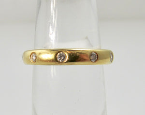 18k flush set diamond band