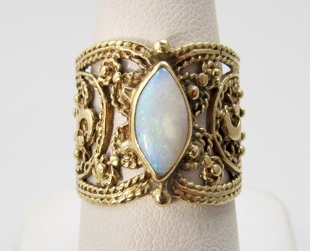 Wide cigar band opal ring