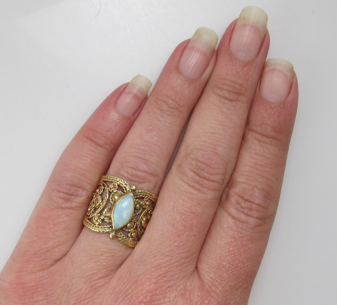 Wide cigar band opal ring