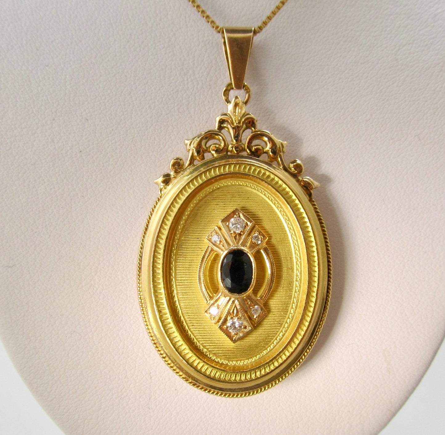 Sapphire and diamond locket necklace