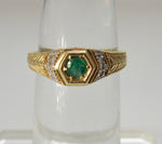 Yellow gold emerald and diamond ring