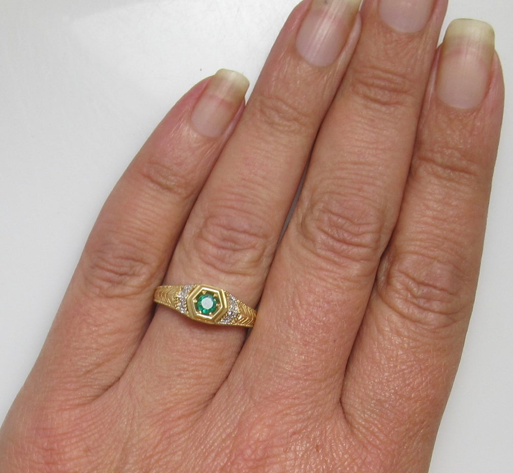 Yellow gold emerald and diamond ring